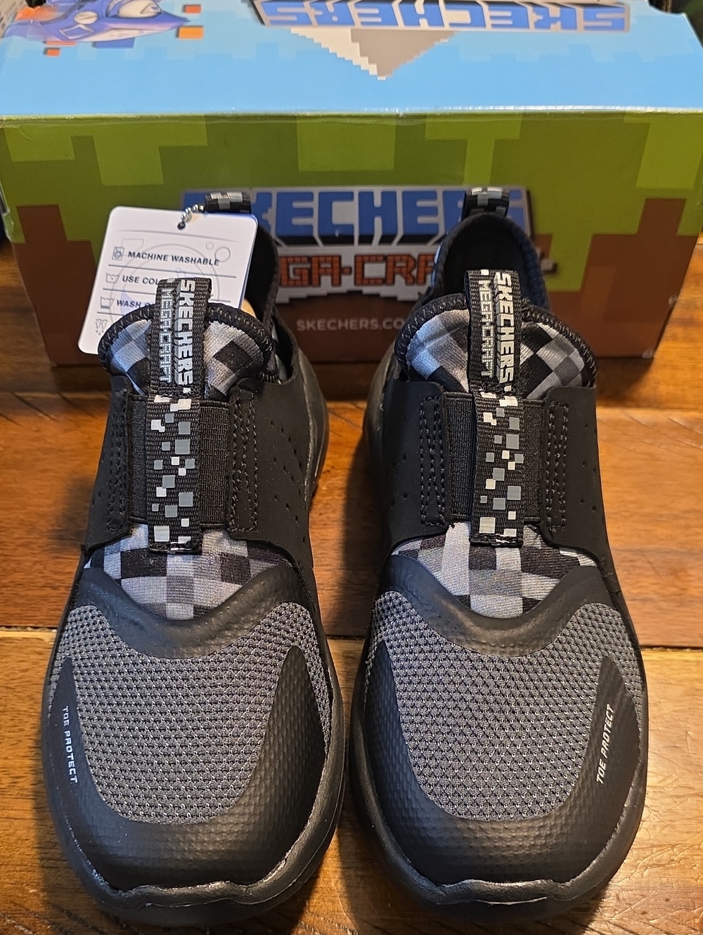 Skechers Mega-Craft Black and Gray Slip-On Sneakers with Checkered Accents